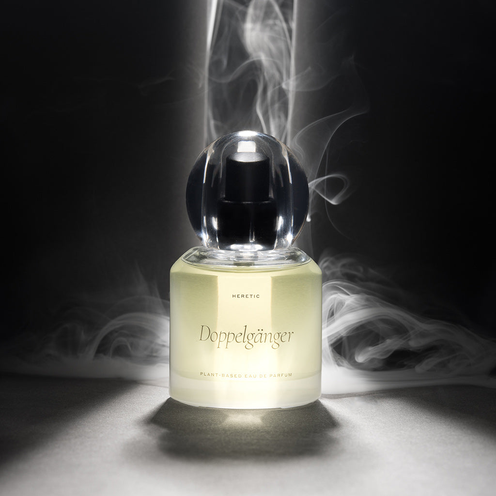 Perfume bottle labeled 'Doppelgänger' with smoke effect on a dark background