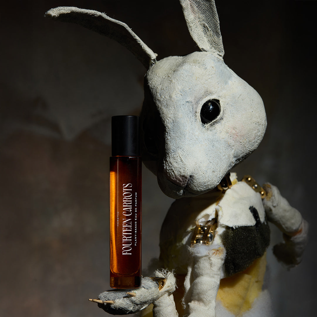 Small rabbit plush toy with a bottle of Fourteen Carrots perfume