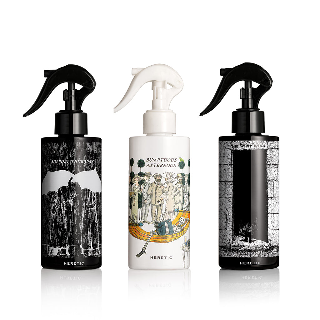 Three bottles with artistic labels on a white background
